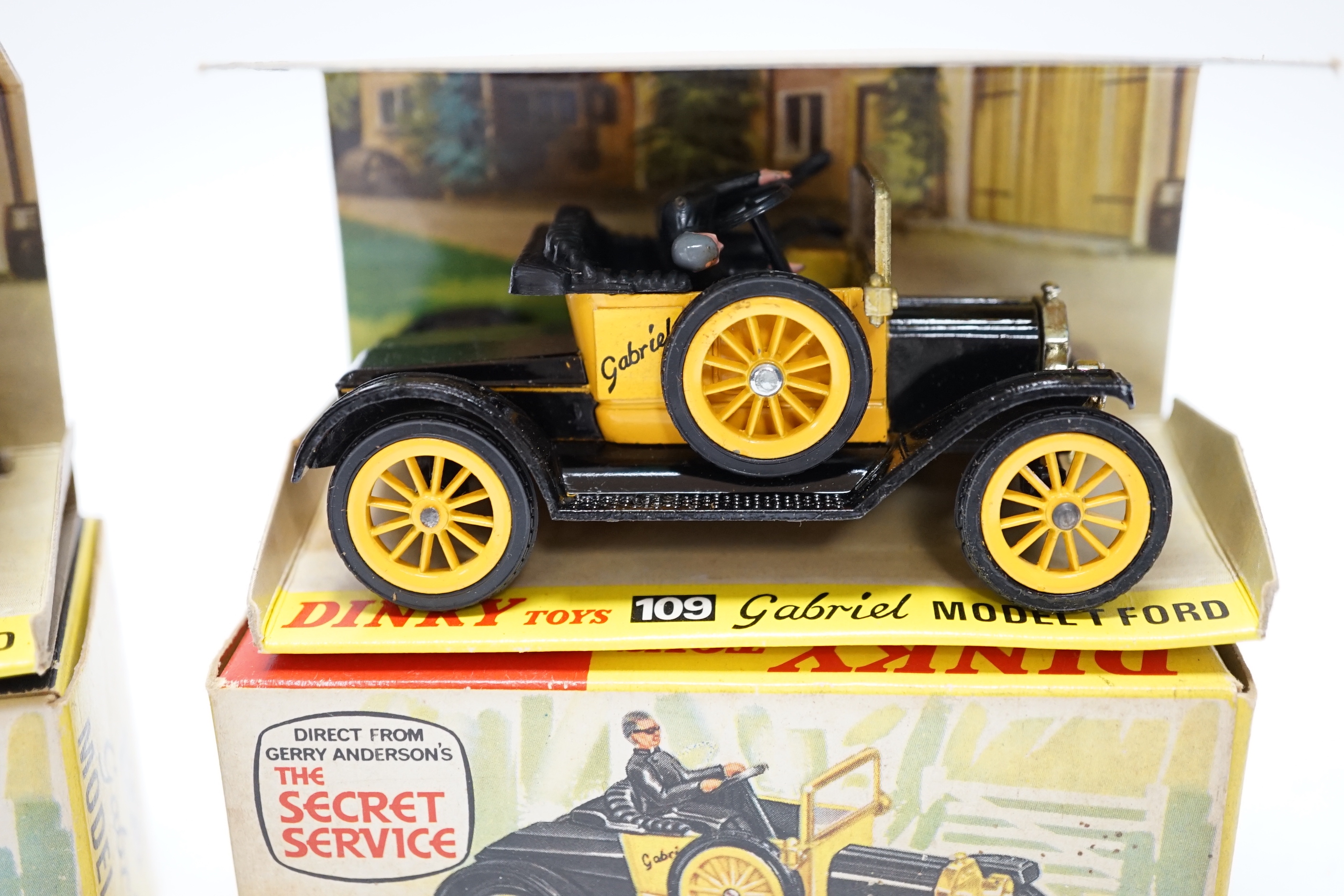 Two Dinky Toys (109) Gabriel Model T Ford, both boxed with inner display stands